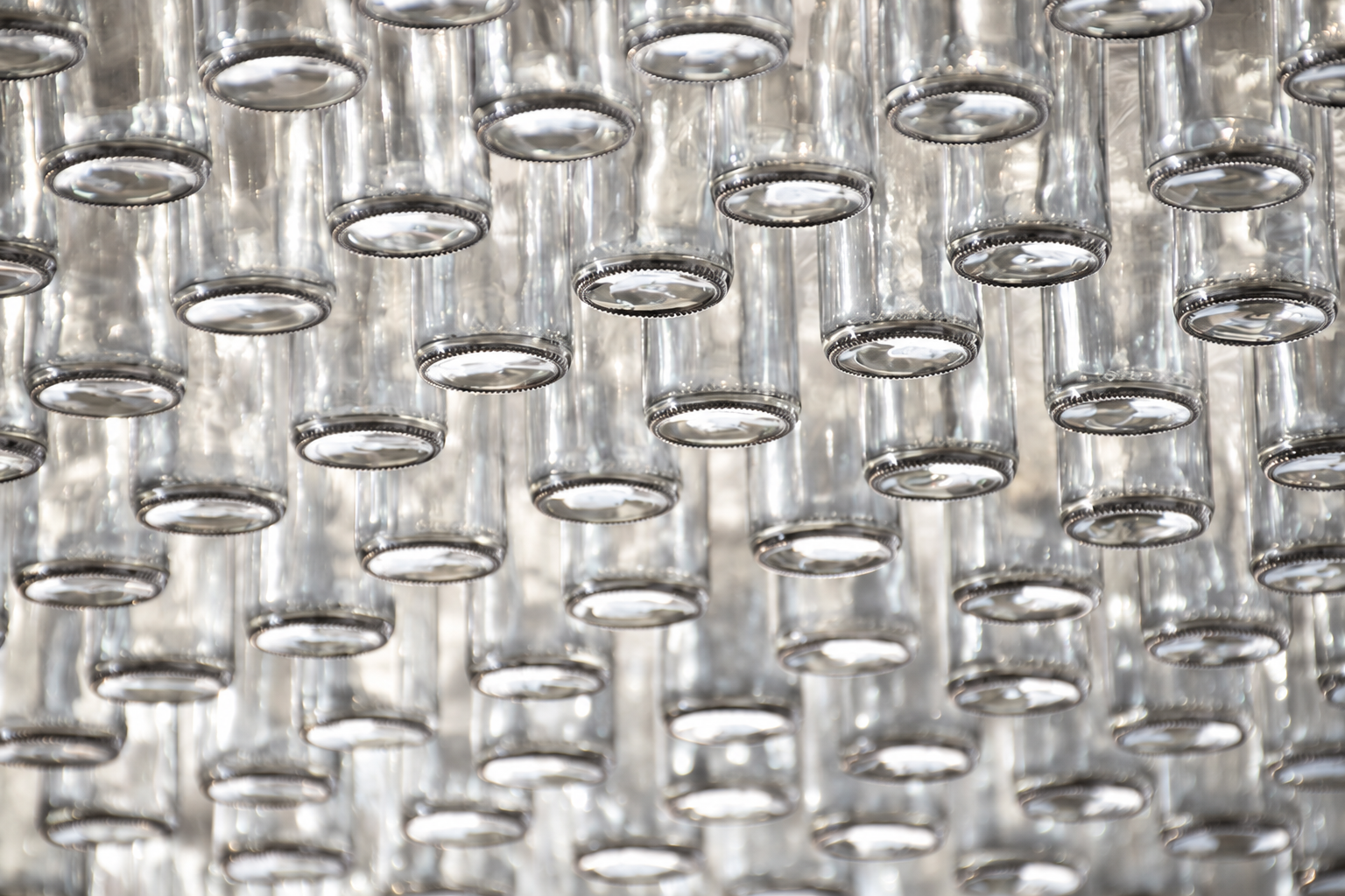 Hanging clear glass bottles
